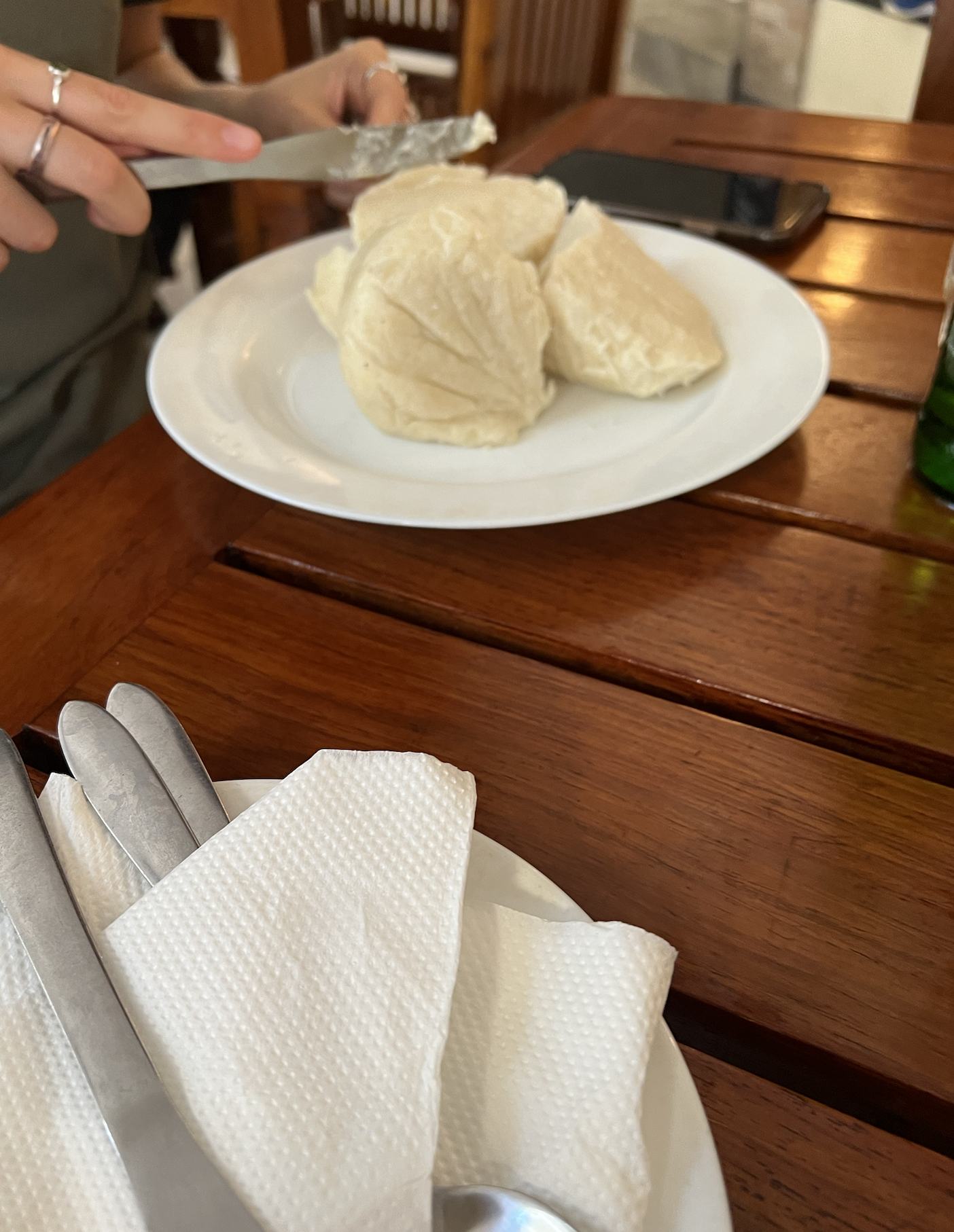 Cutting 'open' a ball of ugali with a fork and knife